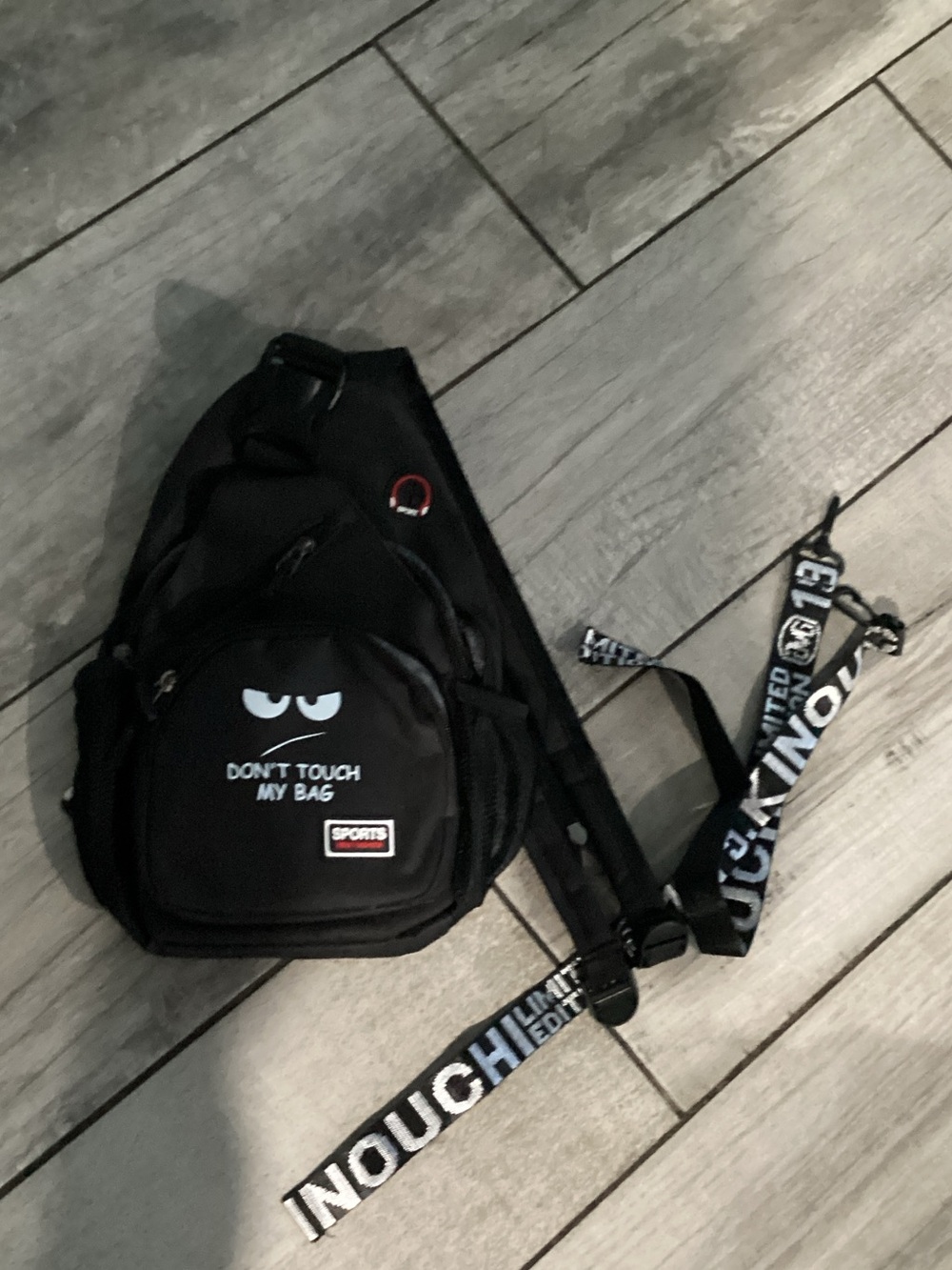 Black Sling Backpack with 'Don't Touch My Bag' Graphic